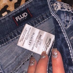 Silver jeans and a pair of American Eagle